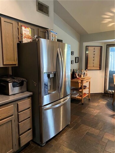 Kitchen area with stainless steel fridge