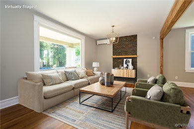 Living area with a wall mounted air conditioner, w
