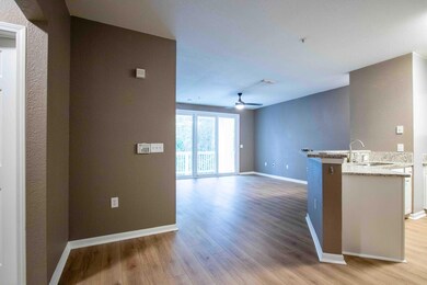 Kitchen leading to dining and living