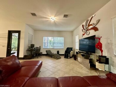 Tiled living room with healthy amount of natural light and a desk
