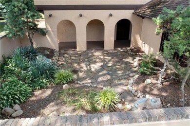 A charming courtyard with a stone patio and a cove
