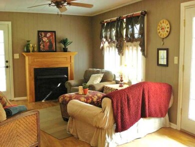 Ventless fireplace and side door opens onto covere
