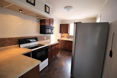 KITCHEN: Plenty of counter space. Lighting above t