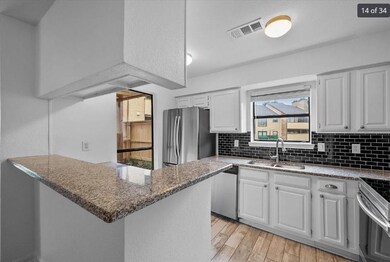 Kitchen featuring a sink, tasteful backsplash, vis