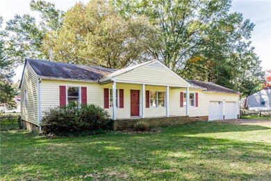 Notice the covered front porch and 2-car garage!