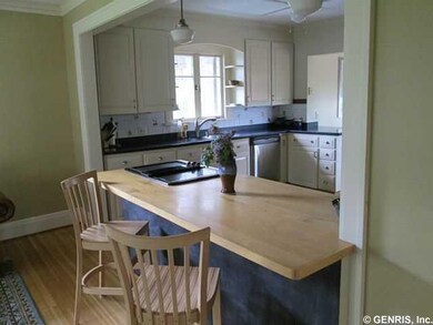 Other View of Breakfast Bar and Drop in Range in K