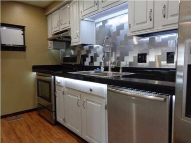 STAINLESS KITCHEN, PAINTED CABINETS, NEW HARDWARE,