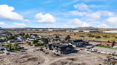Aerial view of residential area featuring a mountainous background