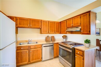 Kitchen with stainless steel appliances, light cou