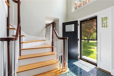 Stunning 15 foot front foyer will wow your guests.