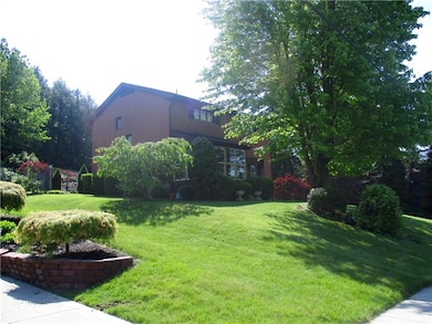 Lovely professional landscaping surrounds this all