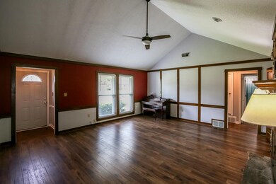 Unfurnished living room with a textured ceiling, c