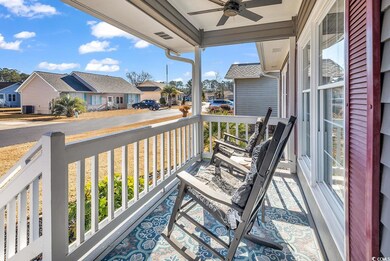 Balcony with central AC unit, ceiling fan, and cov