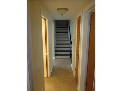 Other bedroom hallway also with tiled floors and n