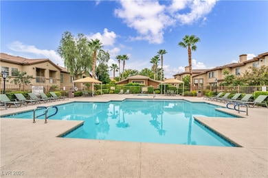 Community pool with a gazebo, a residential view, and a patio area