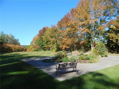Back lawn and garden area. Path that...
