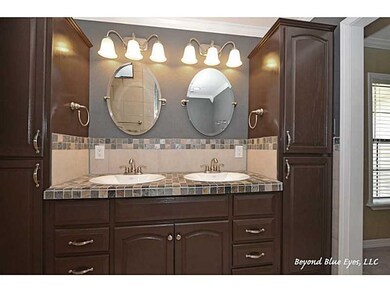 Photo. Stylish cabinetry and double vanity in mast