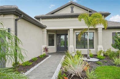 Entrance to property with stucco siding