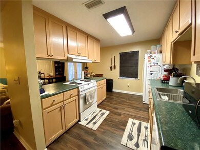 Kitchen features laminate countertops, Hood Vent,