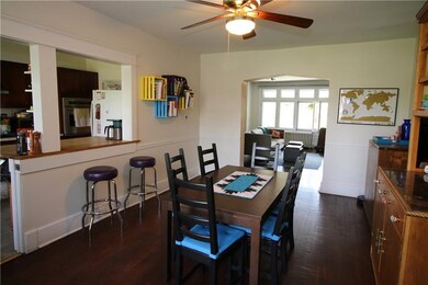 View into living room and kitchen from dining room