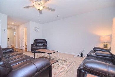 Less than a year old this space offers carpeted fl