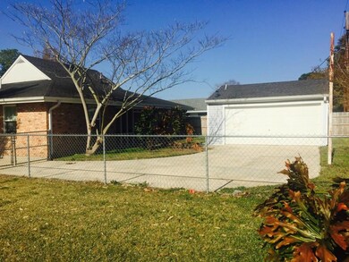 View of the back of your house and garage from you