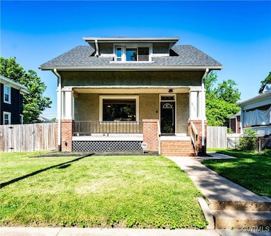 Front view of house featuring a porch, roof with s