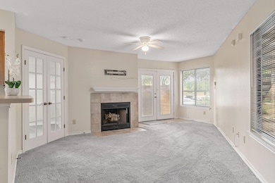 Unfurnished living room with french doors, a ceili