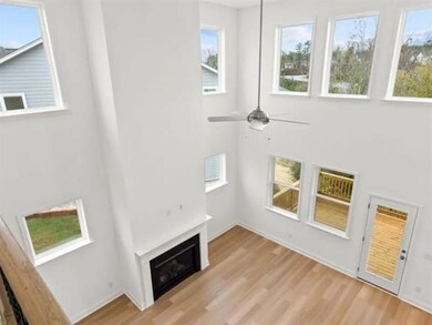 Unfurnished living room with a ceiling fan, light 
