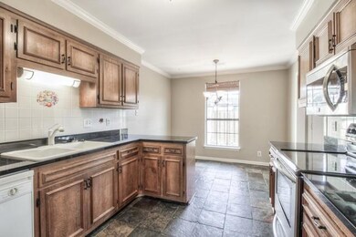 Spacious Kitchen with Upgraded Range, Counters, and Cabinets