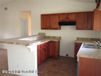 Maple Cabinets with Tile Counter and Bar