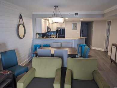 Dining space with dark hardwood / wood-style floor