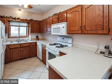 Lovely kitchen with crisp white appliances and cer