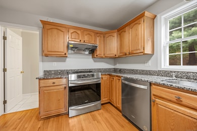 Kitchen features new stainless appliances (2023) including induction oven