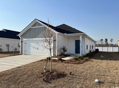 Ranch-style house with driveway, an attached garag