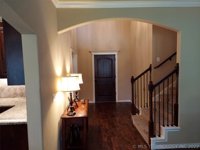 Foyer with stain 8' front door with custom trim ho
