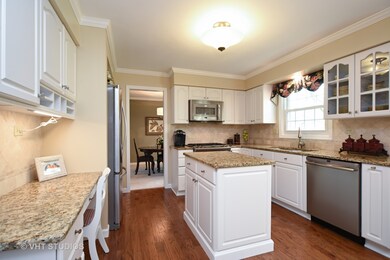 Lovely updated Kitchen with white cabinets, granit