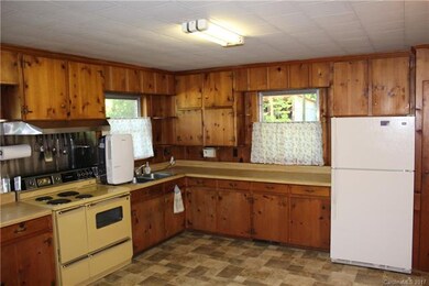 Kitchen with new flooring. Appliances convey with 