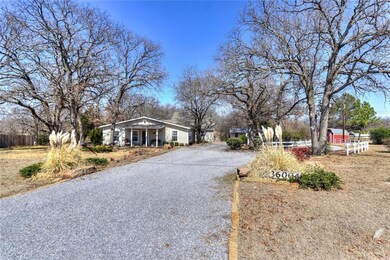 Property with circlular gravel drive.