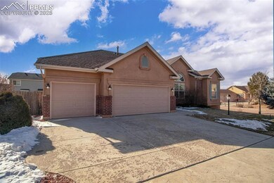 Ranch-style house with concrete driveway, stucco s