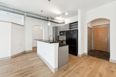 Another angle of the kitchen and primary suite ent