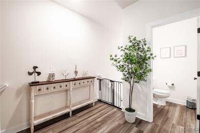 Bathroom featuring wood finished floors and toilet