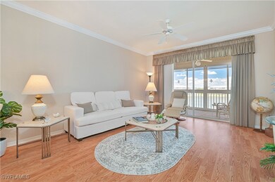 Living room featuring ornamental molding, a ceilin
