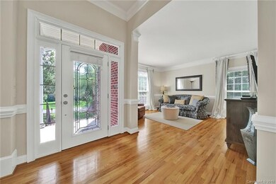 Bright and open entry with formal living room on l