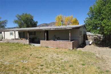 Backyard, with covered patio and hot tub