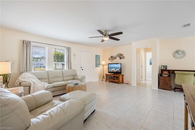 Tiled living room with ceiling fan