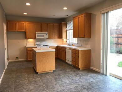 Kitchen pantry tile floors, and entrance to back yard.  Family room - kitchen combo.