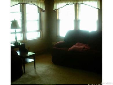 Living Room. Another angle of the living room with over abundance of natural light !