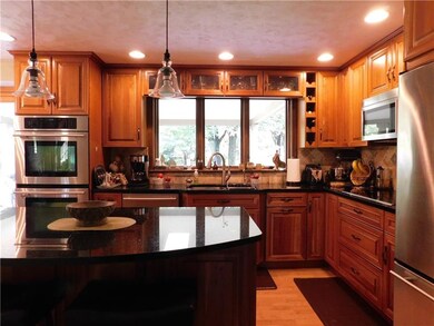 Gorgeous cherry cabinetry with Jenn-Air stainless 