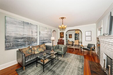 Living Room. Arched doorway to dining room